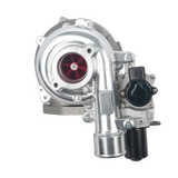 A silver metallic automotive turbocharger with a red internal turbine visible through the intake port, mounted on a white background.